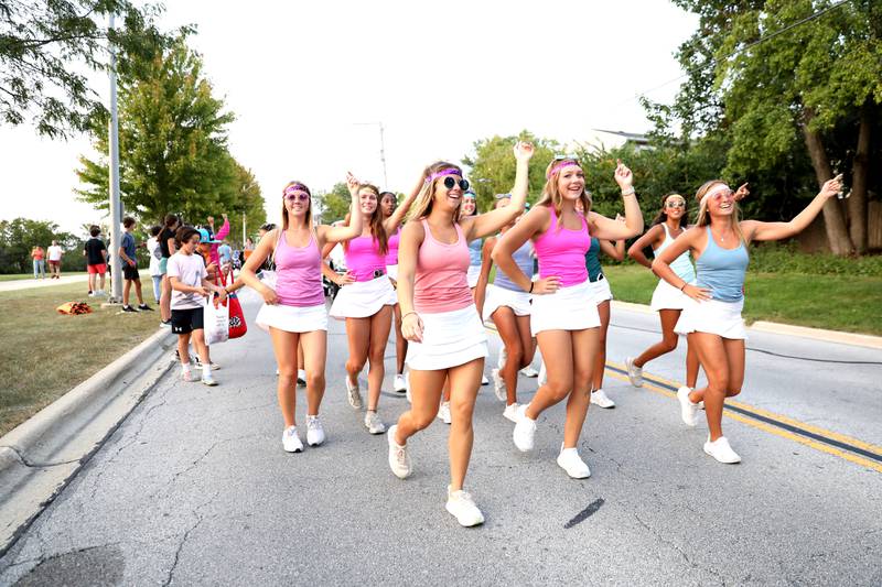 Wheaton Warrenville South students march during the school’s annual homecoming parade on Wednesday, Sept. 11, 2024 on Weisbrook Road in Wheaton.