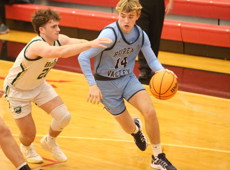 Bureau Valley's Zax Wiggim gets around St. Bede's Gus Burr during the 50th annual Colmone Classic on Thursday, Dec. 12, 2024 at Hall High School.