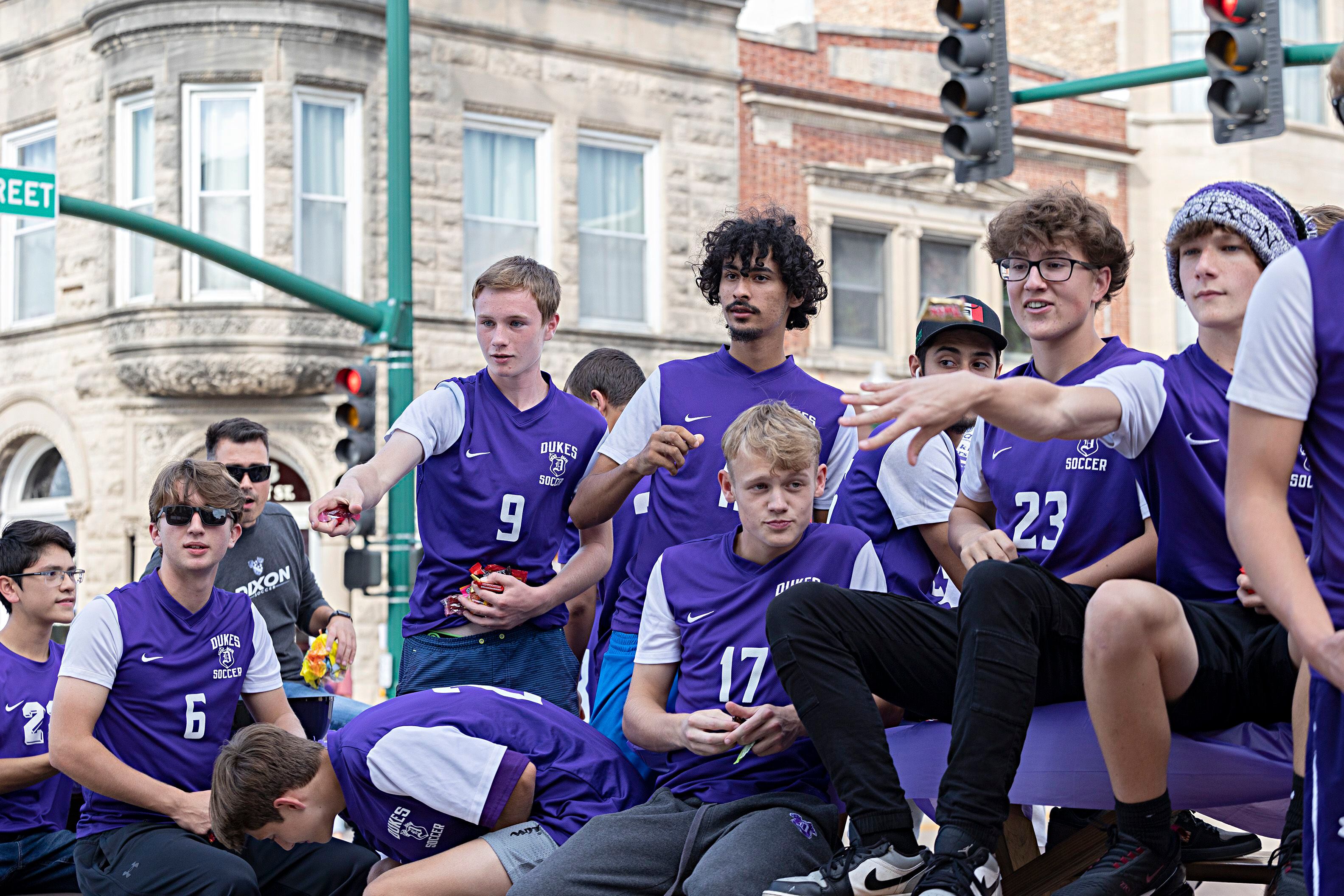 Dixon soccer players fire candy from their float Friday, Sept. 29, 2023.