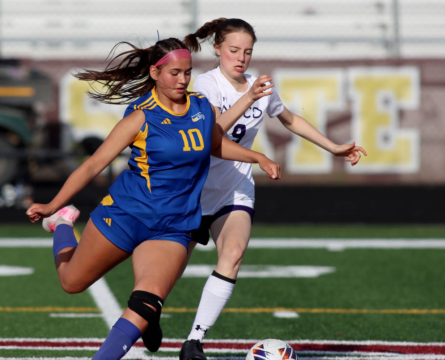 Johnsburg’s London Baidinger, left, races North Shore Country Day’s Alexia Conine for the ball  in IHSA Class 1A Sectional Title Game action at Richmond-Burton High School in Richmond on Tuesday, May 27, 2025.