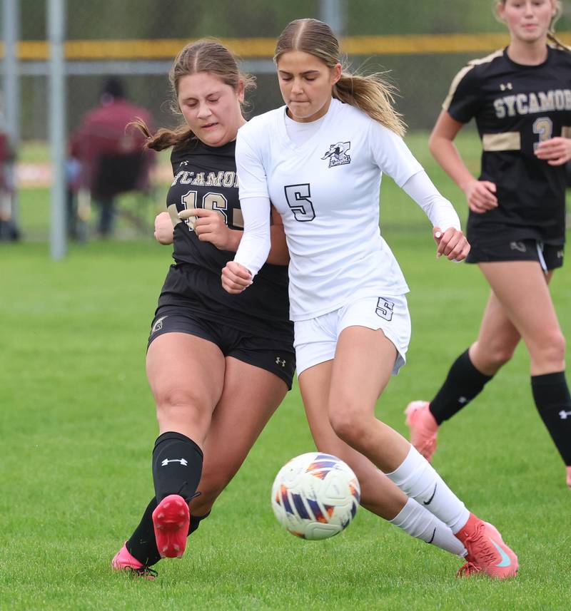 Sycamore's Charlotte Yates and Kaneland's Sophia Rosati fight for possession during their game Wednesday, April 29, 2026, at Sycamore High School.