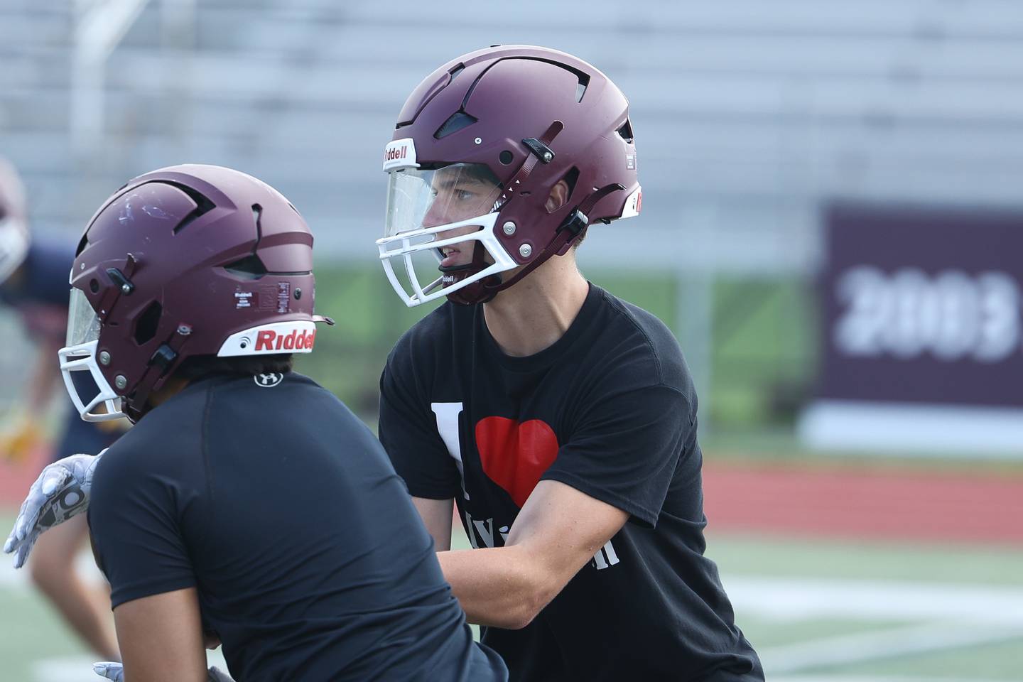 Lockport’s Drew Gallagher hands the ball off during the first day of practice on Monday, Aug. 7, 2023 in Lockport