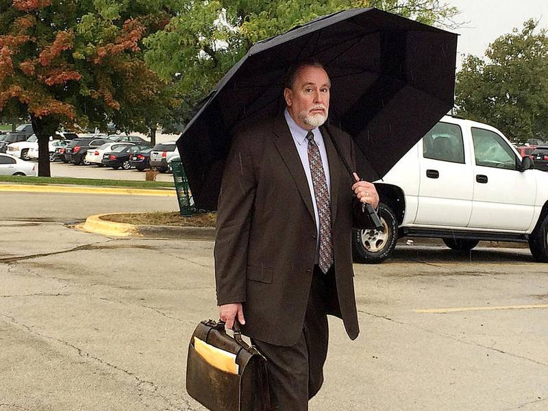 DeKalb School District 428 Superintendent Doug Moeller leaves the Kane County Courthouse in St. Charles on Oct. 6 after an order of protection against him was dismissed. Moeller and District 428 officials have reached a tentative separation agreement that would pay him his salary and provide health insurance until he retires April 30.