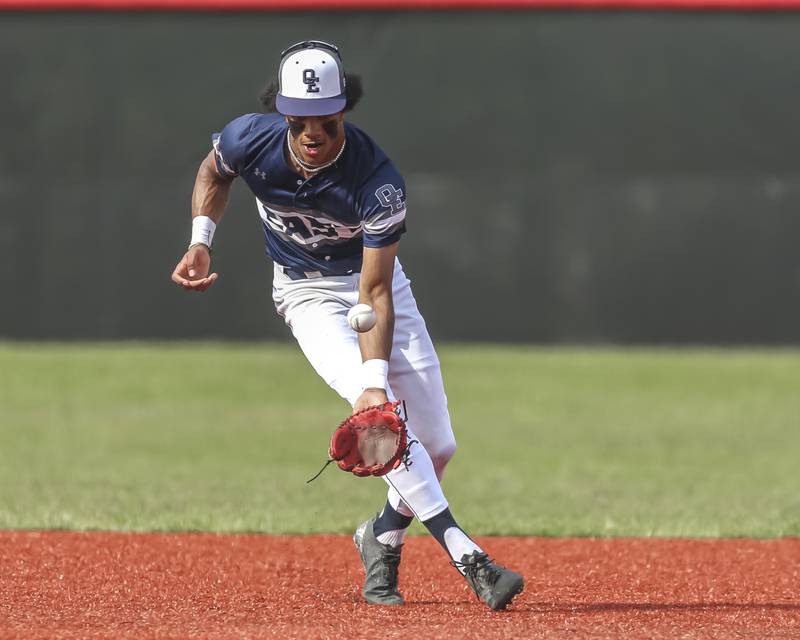 Oswego East's Jacsen Tucker (17) fields a bouncer at short during baseball game between Oswego East at Yorkville. Monday, May 12, 2025 in Yorkville.