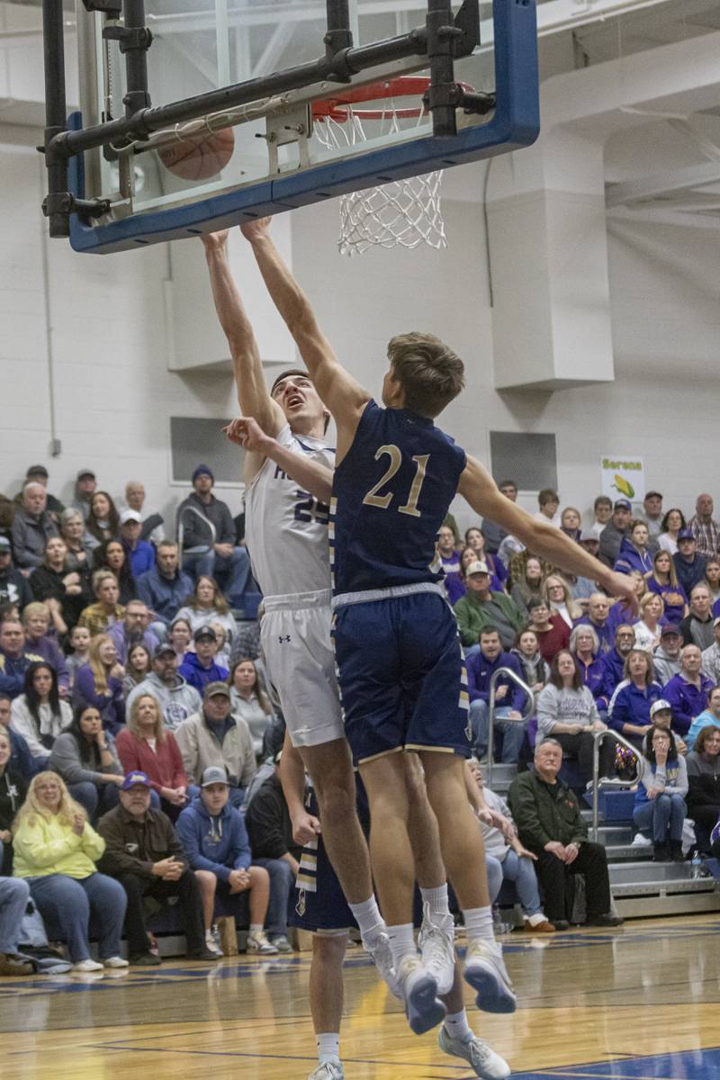 Marquette Academy's Charlie Mullen attempts to block a layup from Richie Armour of Serena Highschool during the IHSA Class 1A boys basketball Regional Championship at Serena High School on February 23, 2024.