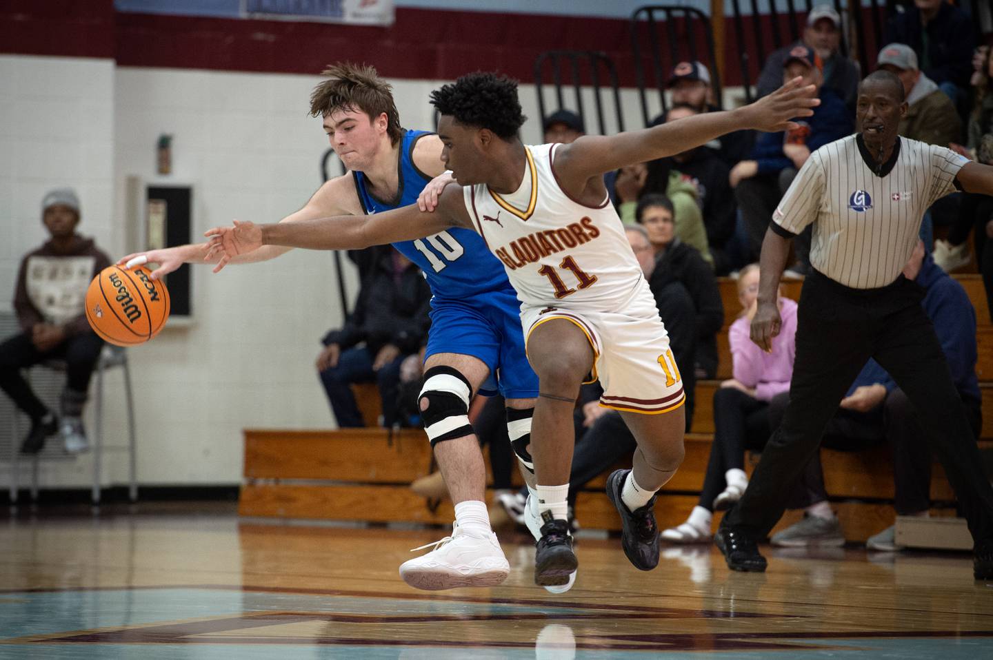 Clifton Central's Blake Chandler, left, attempts to keep the ball away from Christ the King's Treyvon Brown-Wells during a game in the Kankakee Holiday Tournament at Kankakee High School on Saturday, December 27, 2025.