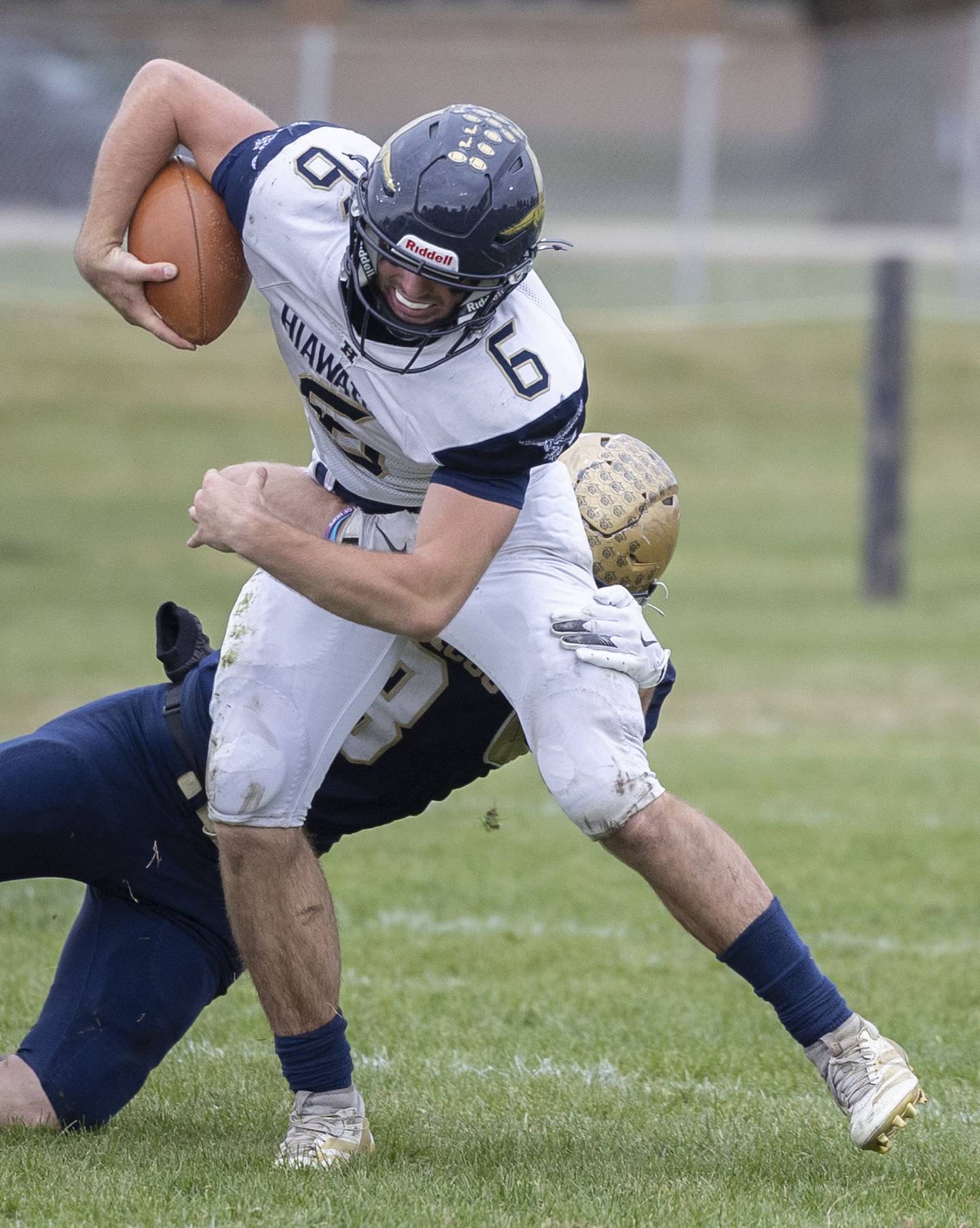 Hiawatha’s Aidan Cooper fights for yards against Polo Saturday, Nov. 1, 2025, in the 8-man football playoff quarterfinals.