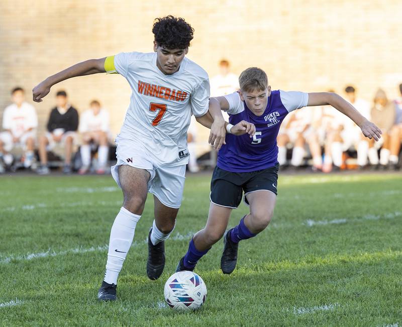 Winnebago’s Brandon Armenta and Dixon’s Nolan Vale fight for the ball Thursday, Sept. 26, 2024, at Dixon High School.