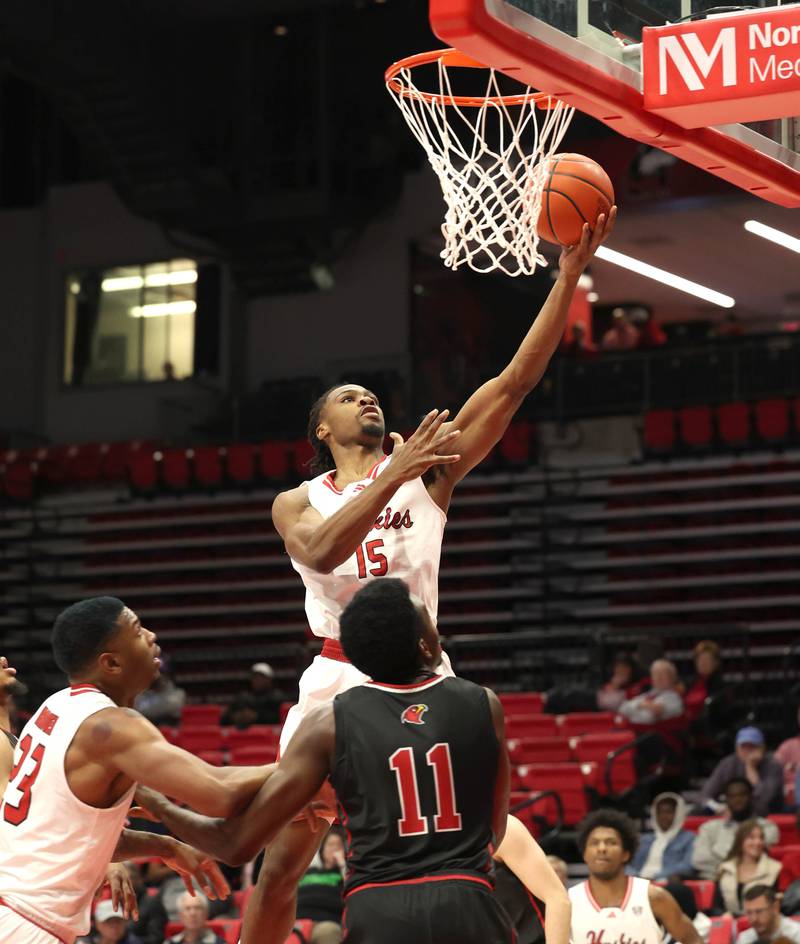 Northern Illinois' Ethan Butler scores over Illinois Tech's Joshua Iguade during their game Monday, Nov. 13, 2023, at the NIU Convocation Center in DeKalb.