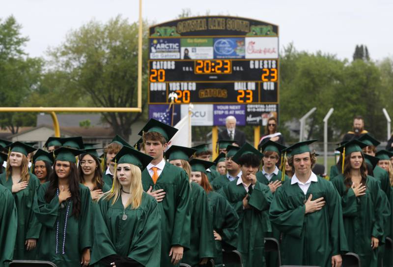 Graduates say the Pledge of Allegiance Saturday, May 13, 2023, during the graduation ceremony for class of 2023 at Crystal Lake South High School in Crystal Lake.