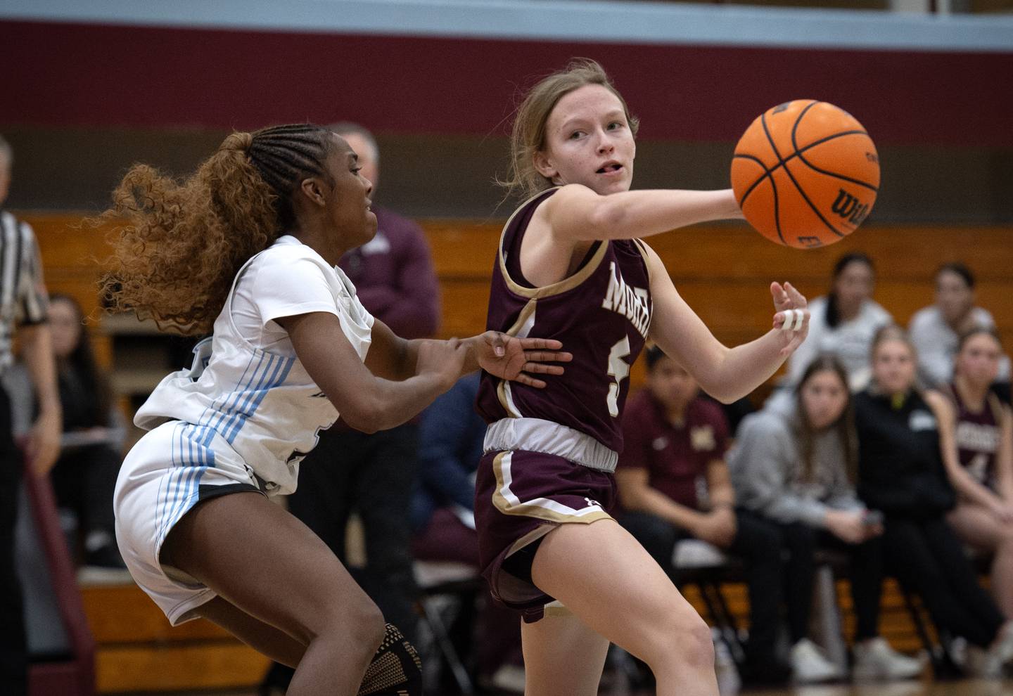 Morris's Ava Petersen passes the ball as Kankakee's Jasyia Wesby guards in a game on Tuesday, January 27, 2026.