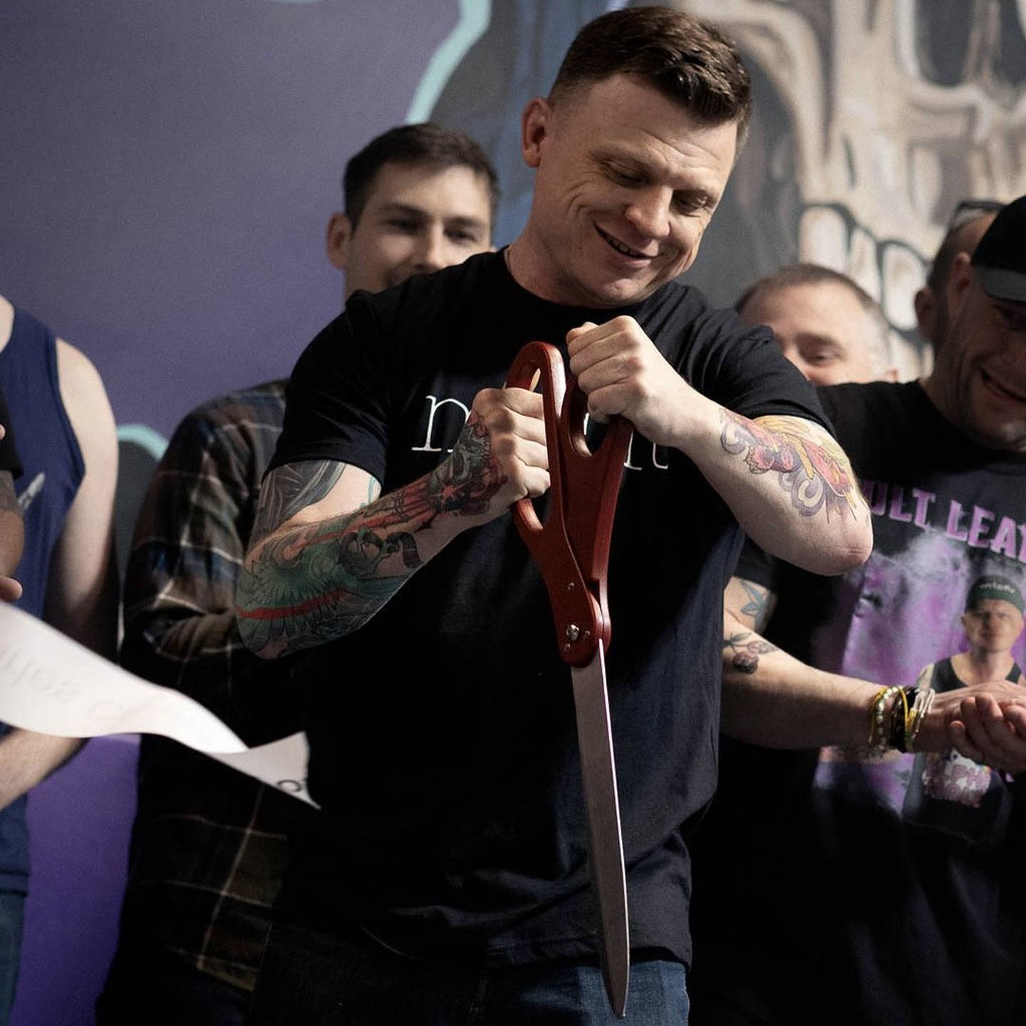 Misfits JiuJitsu owner Brad Edmondson cuts the ribbon during the St. Charles Chamber of Commerce event for the gym's new location at 3820 Ohio Ave. on April 16, 2025.
