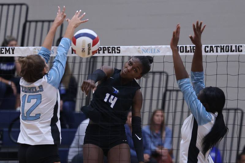 Lincoln-Way East's Alaina Pollard powers a shot against Joliet Catholic on Monday, Sept. 23, 2024 in Joliet.