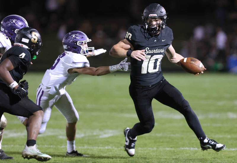 Sycamore's Burke Gautcher gets outside of a Rochelle defender during their game Friday, Sept. 22, 2023, at Sycamore High School.