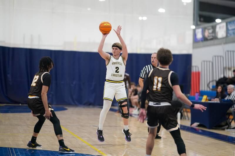 Yorkville Christian's Brady Sovern (2) shoots a three pointer against Joliet Catholic's Jeremy Sterrett jr (12) during a basketball game at Yorkville Christian High School on Monday, January 13, 2025.