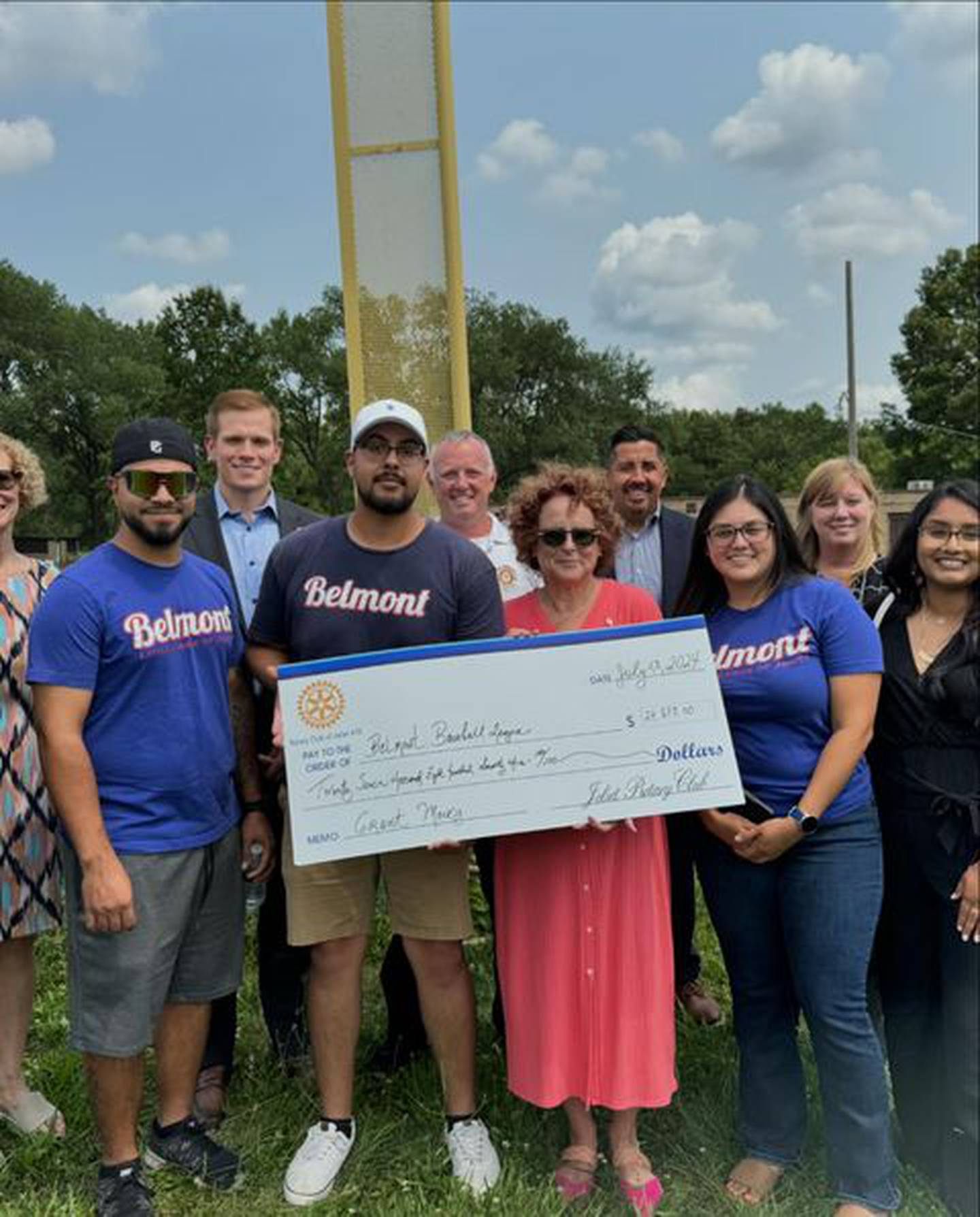 The Rotary Club of Joliet recently donated $27,873.00 of its raffle money to Joliet’s Belmont Little League to help replace the league's fence. Pictured, from left, are Albert Perez Vargas (Belmont), Matt Dollinger (Rotary), Juan Jose Martinez (Belmont), Joliet Fire Chief Jeff Carey (Rotary), Mary Kay Sheehan (Rotary), Cesar Cardenas (Joliet City Council), Maribel Bedolla (Belmont), Megan Millen (Rotary) and Silvia Onate (Belmont).