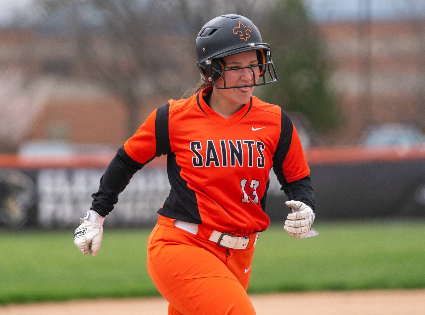 St. Charles East's Mel Stathopoulos (13) smiles as she heads for home after homering against St. Charles North during a softball game at St. Charles East High School on Monday, April 25, 2022.