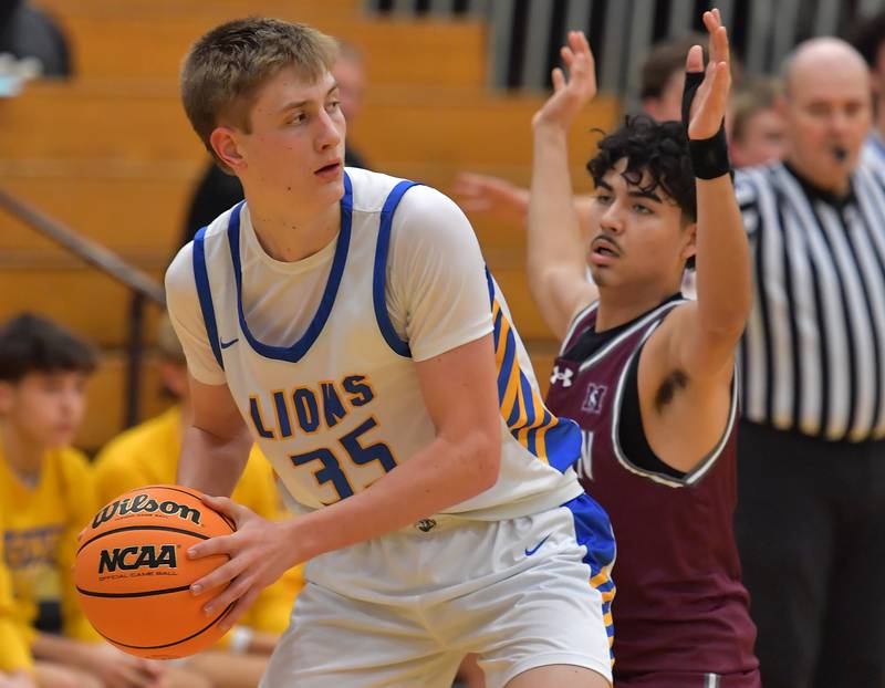 Lyons Township's Ian Polonowski (35) looks to pass during a Thanksgiving Tournament game against Morton on November 25, 2024 at Lyons Township High School in LaGrange.