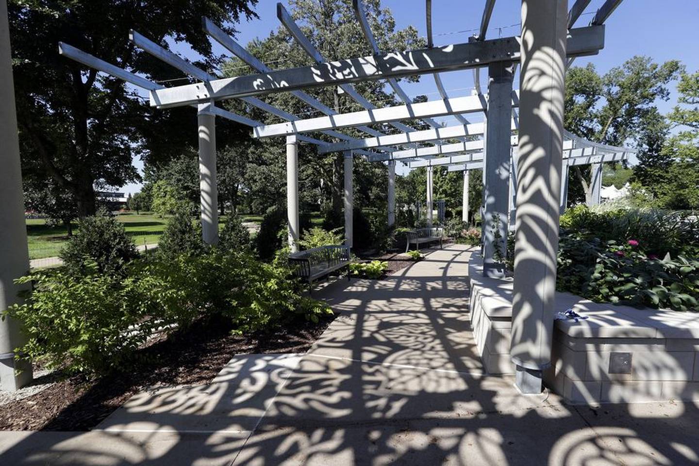 Tall porticos are laser cut with leaf shapes so "it gives you a great feeling of a grand entrance plus a shadow pattern on the ground," said Susan Jacobson, the project leader for the Morton Arboretum's "Grand Garden."