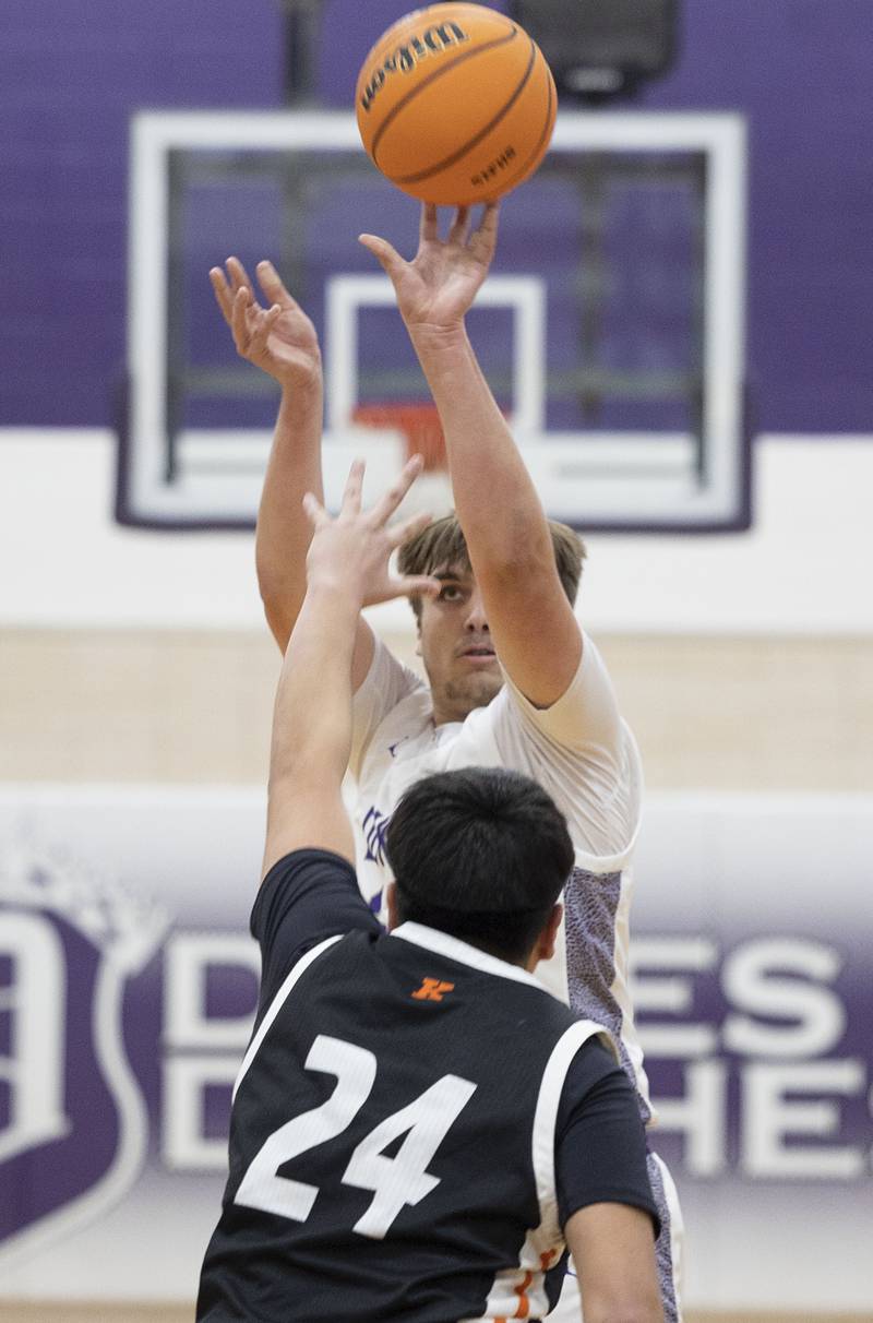 Dixon’s Jakob Nicklaus puts up a shot against Kewanee’s Adiel Arjon Tuesday, Dec. 2, 2025.