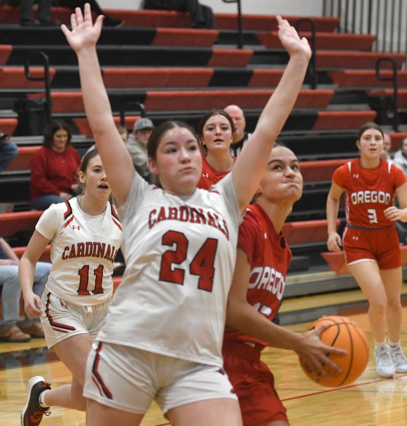 Oregon's Sarah Eckardt (13) looks to shoot as Forreston's Alice Kobler (24) defends during a Saturday, Jan. 3, 2026 game at Forreston High School.