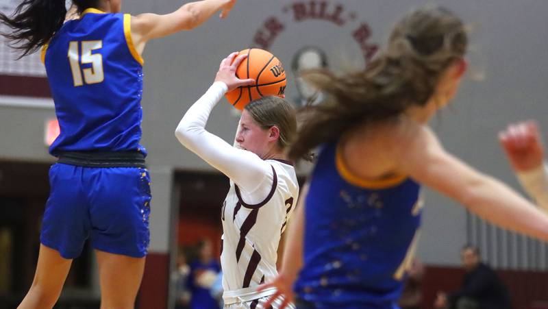 Marengo’s Maggie Hanson passes the ball against Johnsburg in varsity girls basketball on Tuesday, Jan. 6, 2026 at Homer “Bill” Barry Gymnasium on the campus of Marengo High School in Marengo.