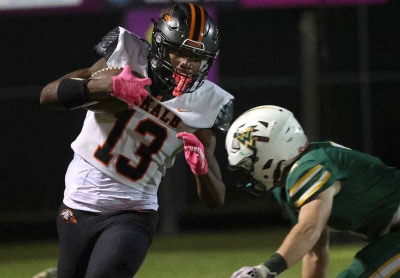 DeKalb's Davon Grant tries to avoid Waubonsie Valley’s Seth Gilliland during their game Friday, Oct. 11, 2024, at Waubonsie Valley High School in Aurora.