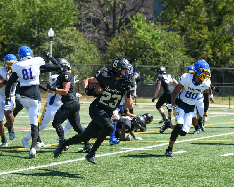 Sycamore Dylan Hodges (23) runs for a 92 yard touchdown during the second quarter Saturday Sep. 2,2023 while taking on Simeon at Gately Stadium in Chicago.