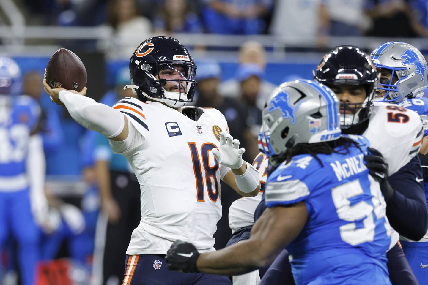 Chicago Bears quarterback Caleb Williams (18) throws against the Detroit Lions during the first half of an NFL football game, Sunday, Nov. 17, 2024, in Detroit. (AP Photo/Carlos Osorio)