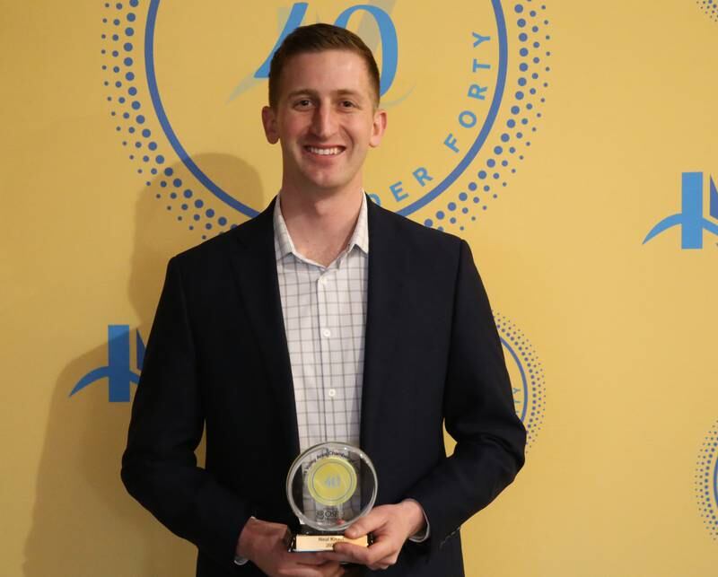 Neil Knauf poses for a photo with his award during the 40 Under Forty awards banquet on Thursday, March 21, 2024 at Westclox in Peru.