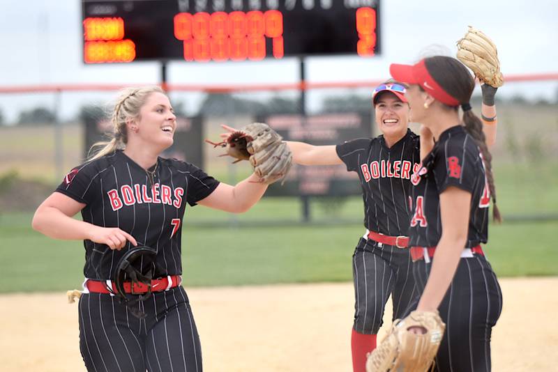 From left, Bradley-Bourbonnais' Lydia Hammond, Shannon Lee and Liv Woolman congregate to celebrate the Boilermakers' 2-0 victory over Normal Community in the Class 4A Normal Community Regional championship Friday, May 22, 2026.