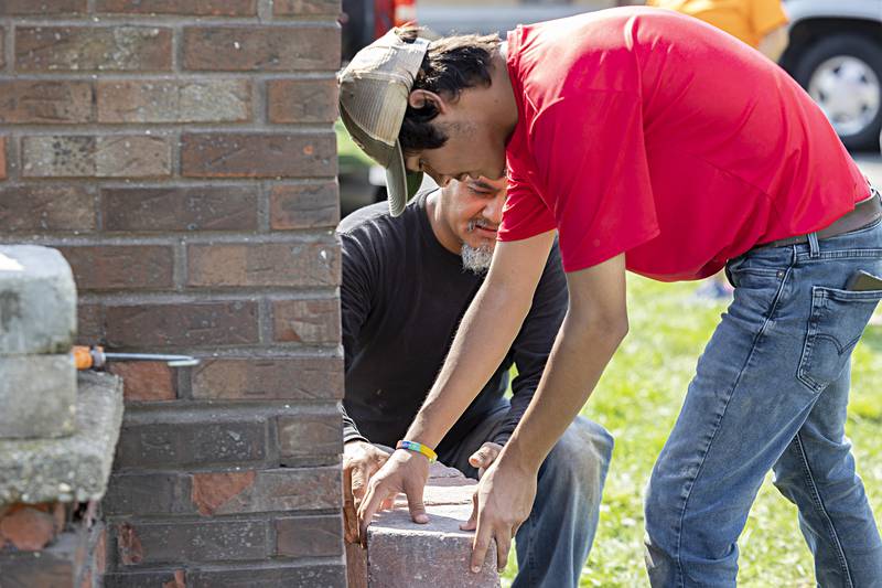Diego Ocampo, 17, Eagle Scout candidate for scout troop 85, in Dixon works with his dad Juan on his project Saturday, Sept. 23, 2023 in Dixon. Through the help from the scouts and the Dixon Noon Lions Club, Ocampo is renovating the Welcome to Dixon sign on North Galena Avenue.