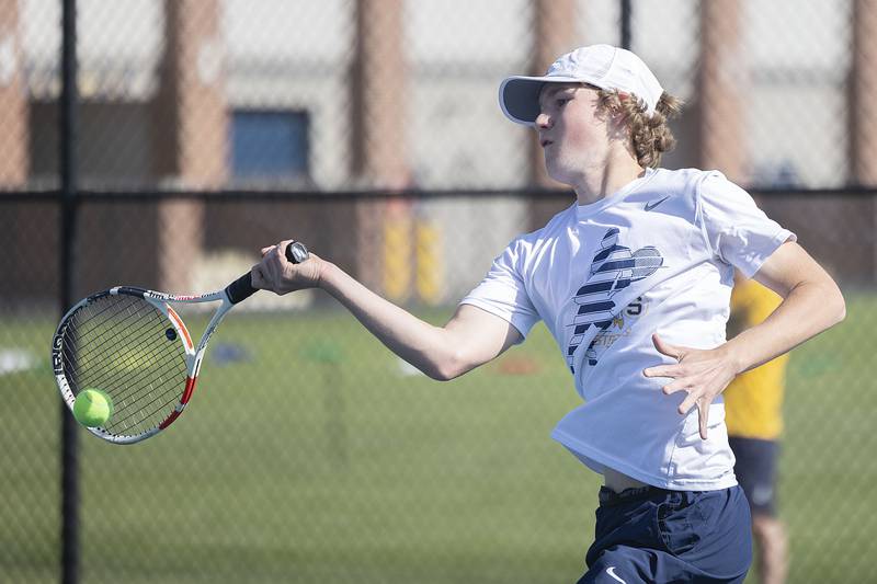 Sterling’s Brecken Peterson plays a shot to Dixon’s Damien Beck in a tennis match Thursday, May 4, 2023.