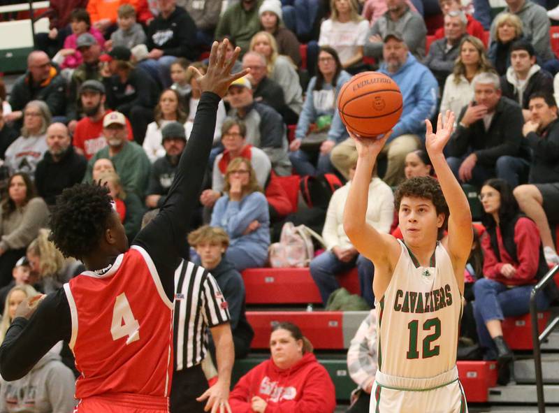 L-P's Michael Hartman eyes the hoop while shooting a shot over Ottawa's Keevon Peterson on Friday, Jan. 5, 2024 at Sellett Gymnasium.