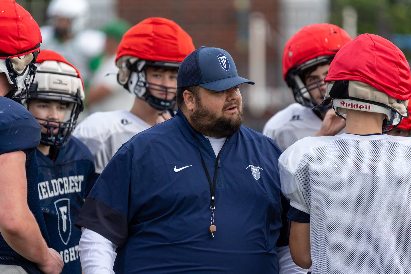 Coach Andrew Quain of Fieldcrest talks with team on Thursday, July 17, 2025 at Dwight High School in Dwight.