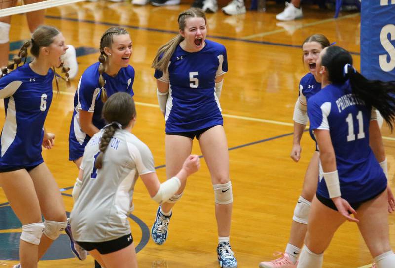 Members of the Princeton volleyball team react after scoring a point against L-P on Tuesday, Aug. 27, 2024 at Princeton High School.