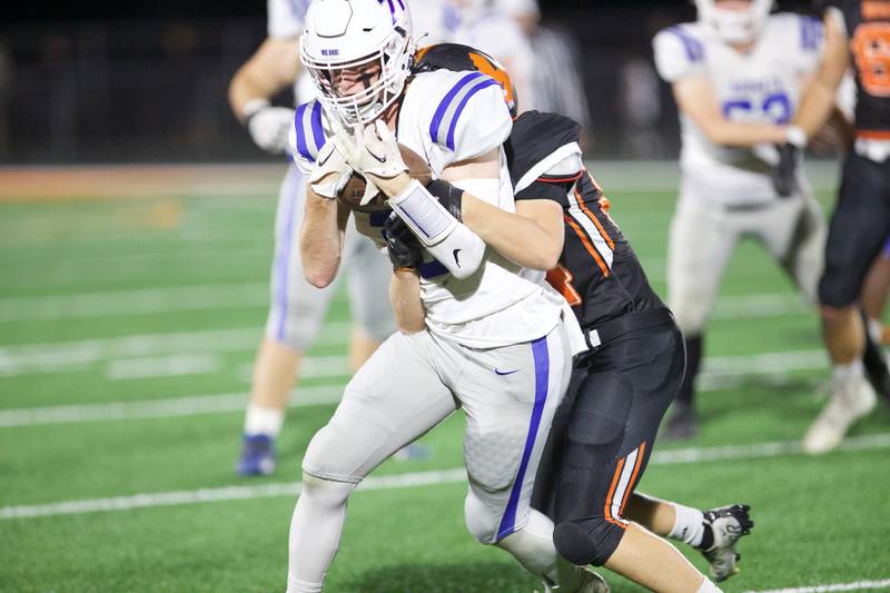 Burlington Central's Lucas Kerr with the carry as McHenry looks for the stop on Friday, Oct. 21,2022 in McHenry.