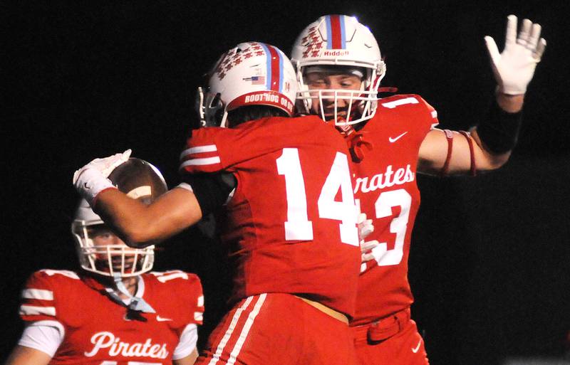 Ottawa's Archer Cechowiz (14) and Ethan Poutre celebrate a Cechowiz touchdown against Streator on Friday, Sept. 5, 2025 at King Field.