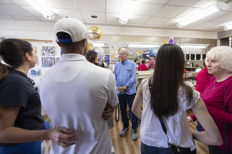 Dick Dir greets friends, family and well-wishers Monday, March 30, 2026, during an open house at Bill and Dick’s Barbershop in Dixon. After 61 years, Dir is hanging up his scissors.