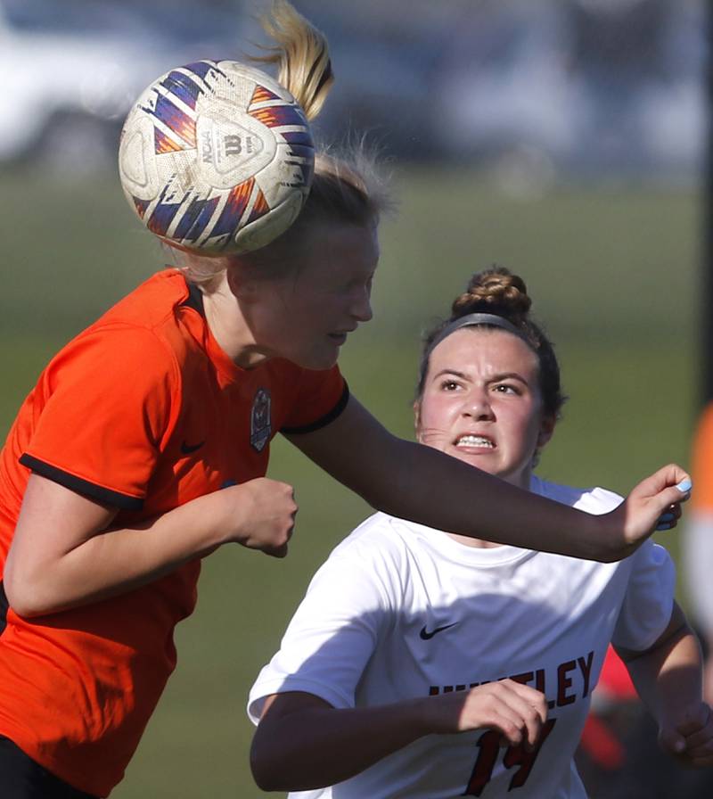 Crystal Lake Central's Lizzie Gray heads the ball in front of Huntley's Sofia Bruns during a Fox Valley Conference soccer game on Tuesday, April 9, 2024, at Crystal Lake Central High School.
