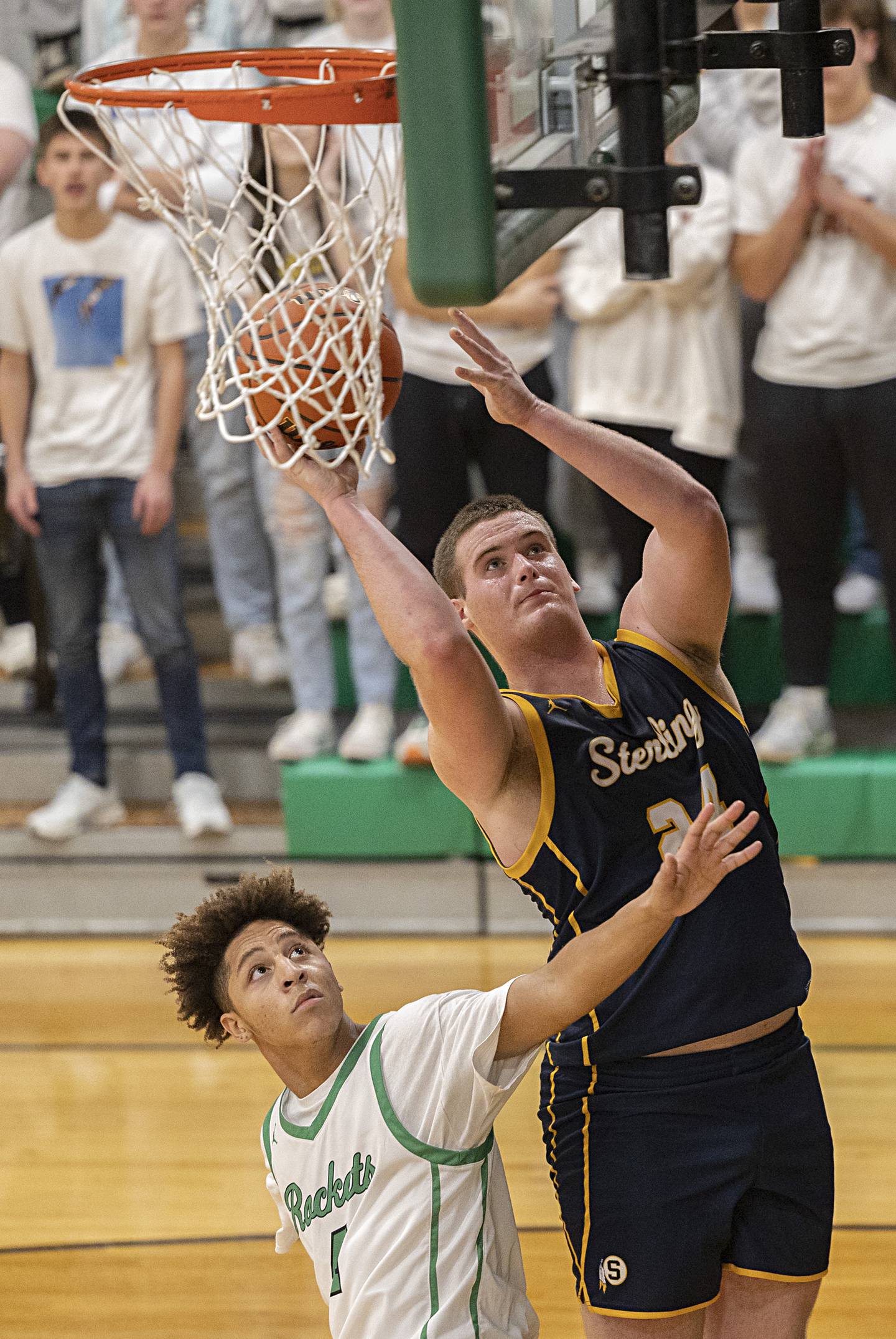Sterling’s Lucas Austin puts up a shot against Rock Falls’ Devin Tanton-Dejesus Tuesday, Nov. 28, 2023 in Rock Falls.