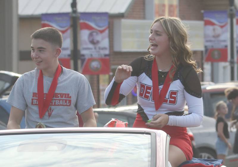 Hall High School sophomore attendants will Kelty and Sophie Simpson ride during the Homecoming parade on Thursday, Sept. 18, 2025 downtown Spring Valley.