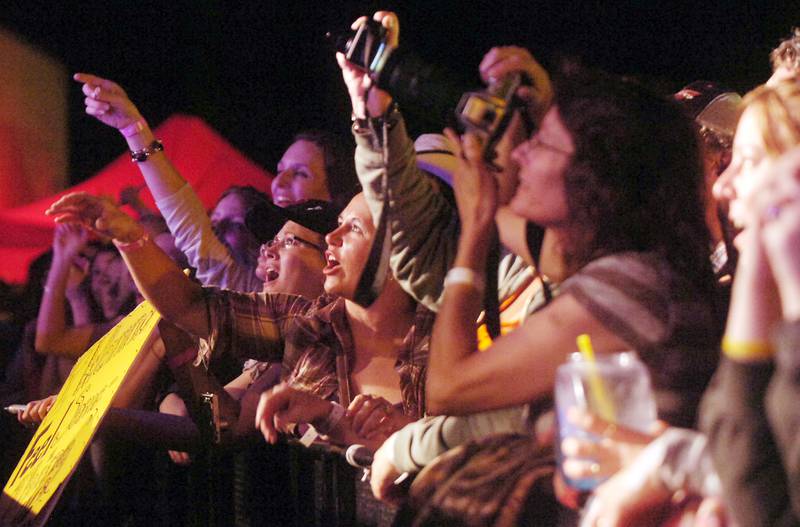 Fans sing along to Trace Adkins as he performed at the Concerts for a Cause series on Saturday, June 25, 2011 at the Illinois Valley Regional Airport in Peru.