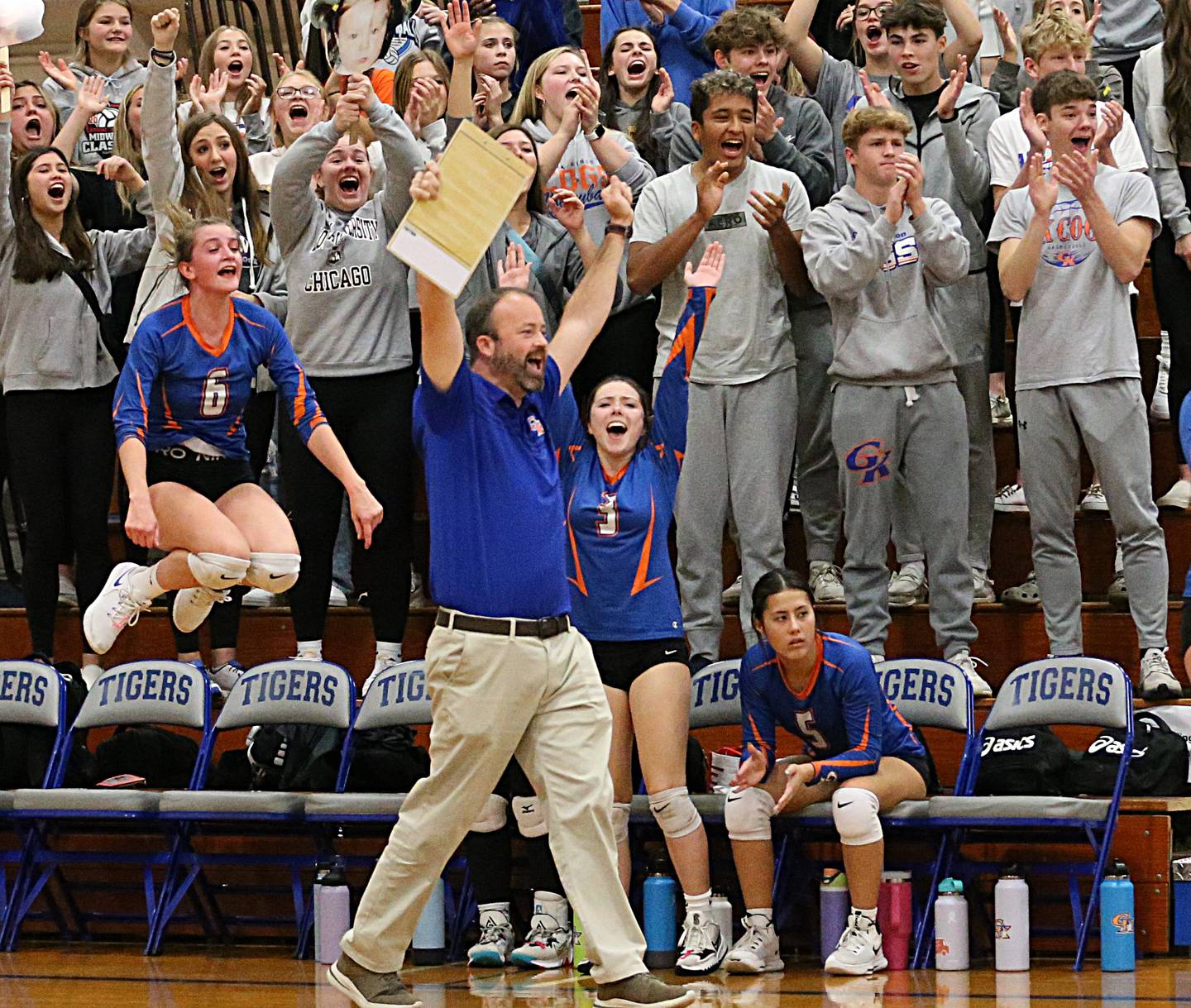 Genoa-Kingston's head coach Keith Foster reacts after his team wins the first set over Quincy Notre Dame in the Class 2A Supersectional volleyball game on Friday, Nov. 4, 2022 at Princeton High School.