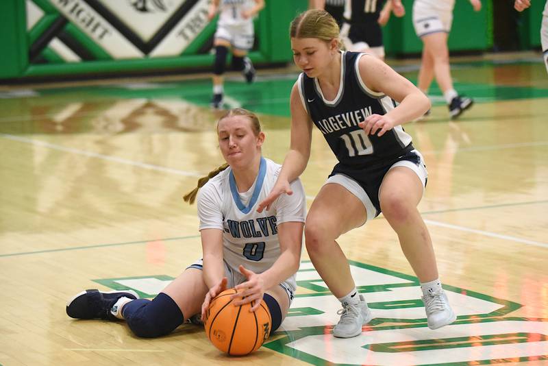 Cissna Park's Addison Lucht, left, beats Ridgeview's Courtney Wesson to a loose ball during an IHSA Class 1A Dwight Regional semifinal game at Dwight Township High School Monday, Feb. 17, 2025.