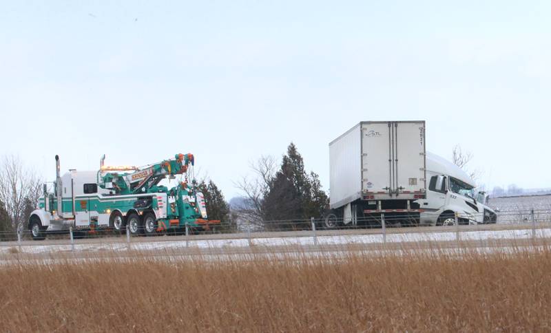 Crews with Senica Towing pull a jackknifed semi truck out of the median of Interstate 80 near mile marker 85 in the westbound lane on Wednesday, Jan. 14, 2026 near Utica. Multiple semi tractor trailers were reported in the median between Utica and Ottawa. Interstate 80 remained closed while crews could remove the wreckage from the accident scenes. A fast moving squall line with gusty winds and snow near white-out conditions caused the wrecks.