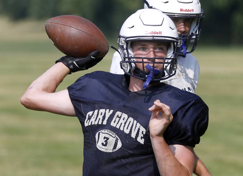 Cary-Grove’s Peyton Seaburg throws a pass during football practice Thursday, June 29, 2022, at Cary-Grove High School in Cary.