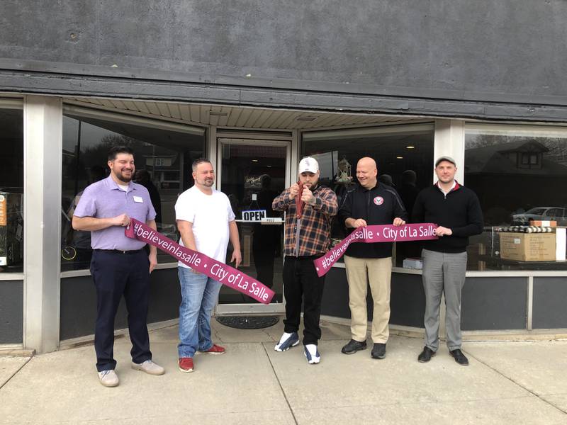 Owners of KP Resale in downtown La Salle celebrate a ribbon cutting ceremony with city officials to announce the grand opening Wednesday, March 1 at 229 Gooding Street.