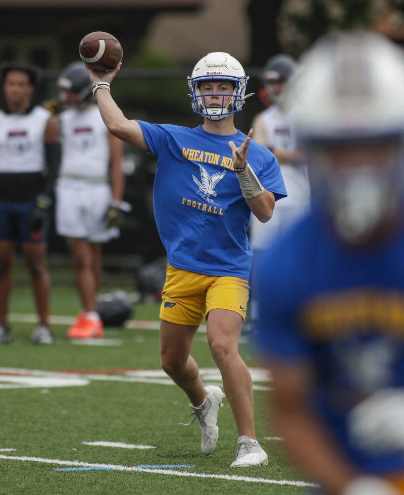 Wheaton North’s Max Houser passes the ball during the Downers Grove South 7-on-7 in Downers Grove on Saturday, July 16, 2022.