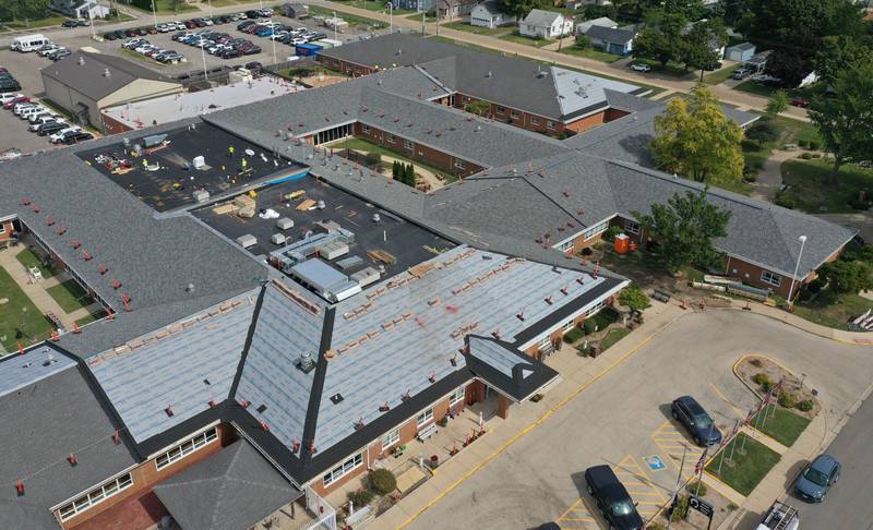 Crews replace the roof on the Illinois Veterans Home on Tuesday, Sept. 23, 2025 in La Salle.